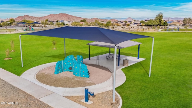 view of home's community with a mountain view, a playground, and a gazebo