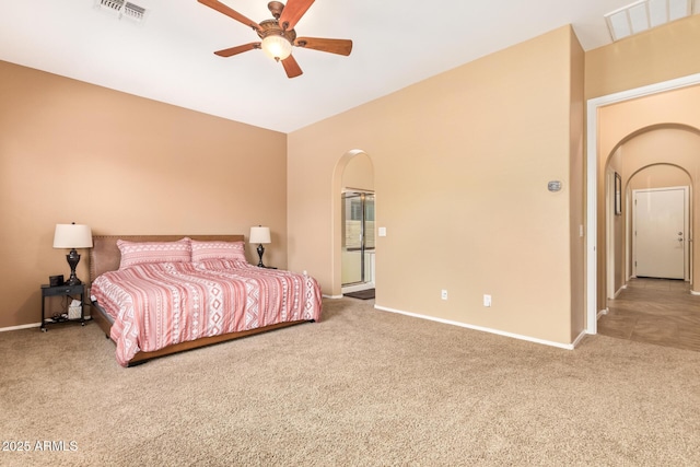 2413 W Kachina Trl, Phoenix, AZ 85041 - carpeted bedroom with arched walkways and a ceiling fan