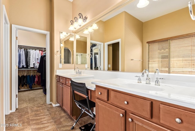 2413 W Kachina Trl, Phoenix, AZ 85041 - bathroom featuring double vanity and a spacious closet