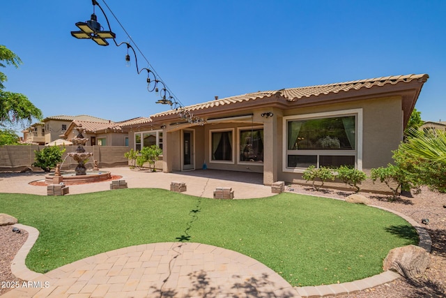 2413 W Kachina Trl, Phoenix, AZ 85041 - back of house with a patio area, stucco siding, and a tiled roof