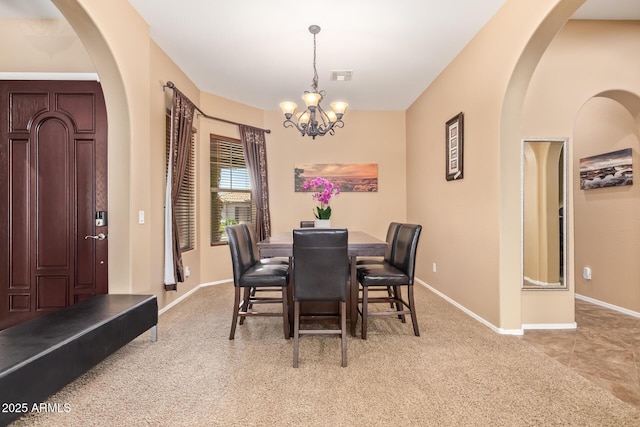 2413 W Kachina Trl, Phoenix, AZ 85041 - carpeted dining room featuring a chandelier and baseboards
