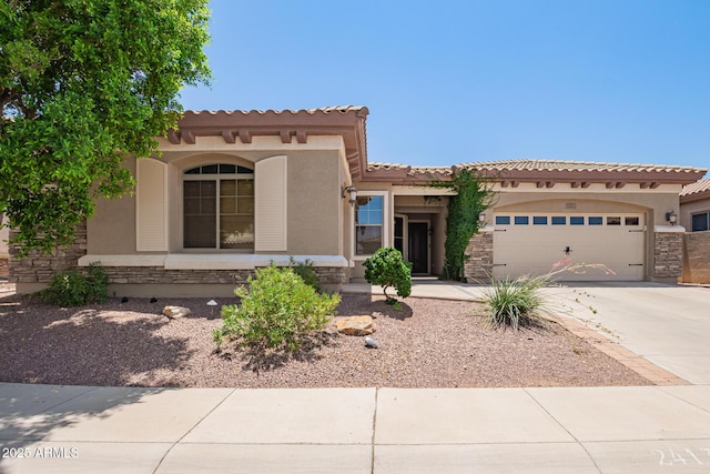 2413 W Kachina Trl, Phoenix, AZ 85041 - mediterranean / spanish home with stone siding, stucco siding, a garage, and concrete driveway