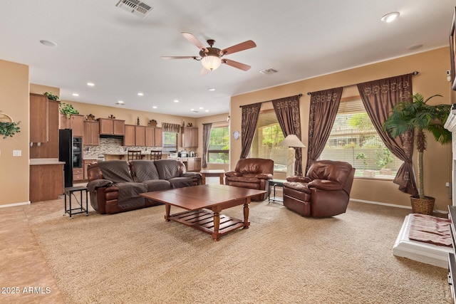 2413 W Kachina Trl, Phoenix, AZ 85041 - living room featuring a ceiling fan, plenty of natural light, and recessed lighting