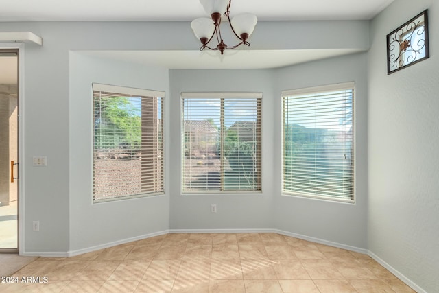 empty room with a chandelier