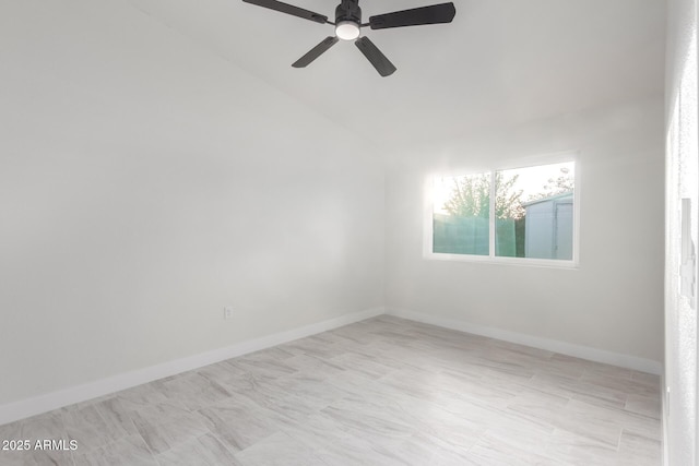 spare room featuring ceiling fan and lofted ceiling