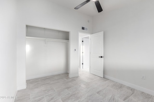 unfurnished bedroom with a closet and ceiling fan