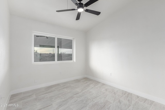 spare room with ceiling fan