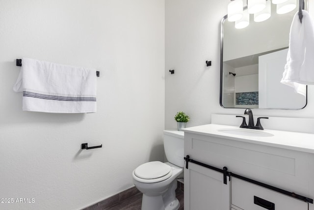 bathroom with toilet and vanity