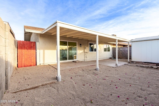 back of house with a patio