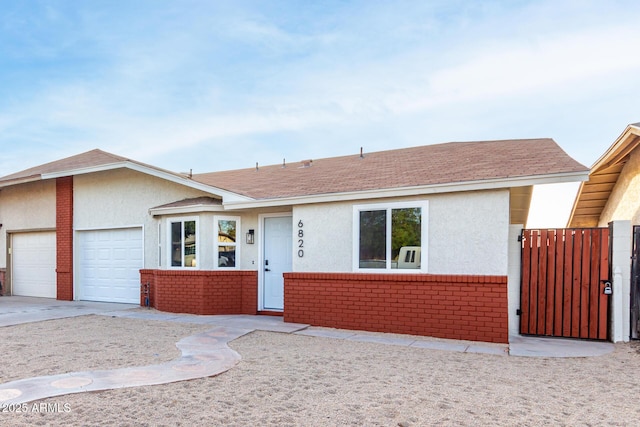 ranch-style home featuring a garage