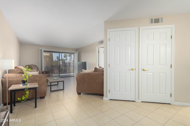 living room featuring light tile floors