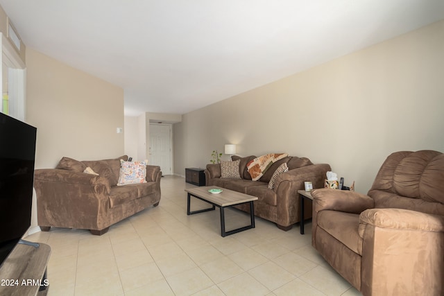 living room featuring light tile floors