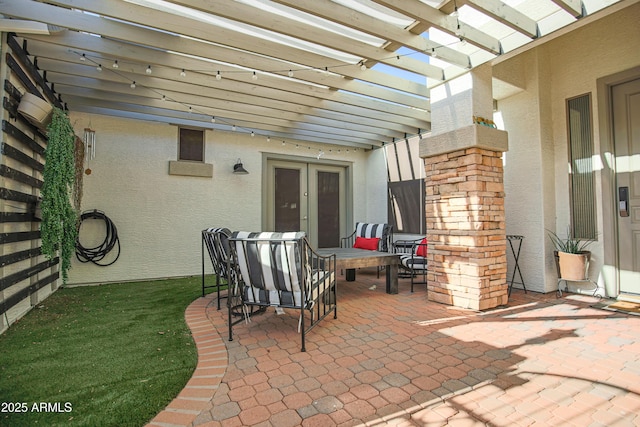 view of patio featuring french doors and a pergola