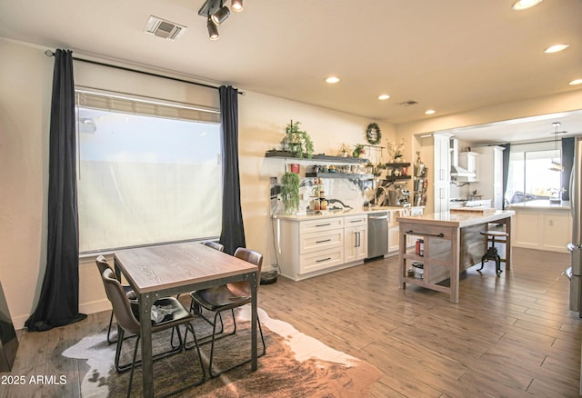 dining area featuring dark hardwood / wood-style floors