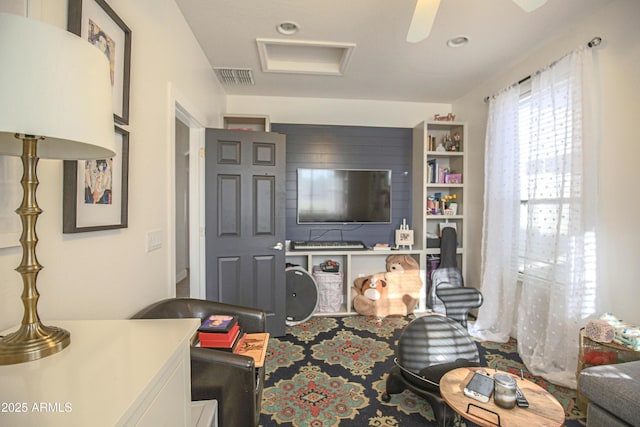 living room featuring ceiling fan