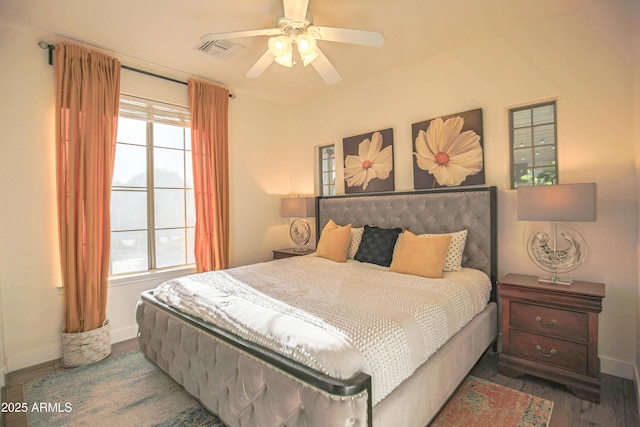 bedroom with hardwood / wood-style flooring and ceiling fan