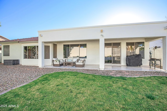 back of house with a yard, an outdoor hangout area, and a patio