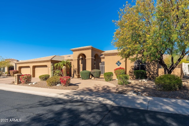 mediterranean / spanish-style house featuring a garage