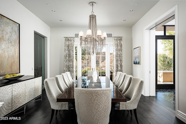 dining room featuring dark hardwood / wood-style floors, a chandelier, and french doors