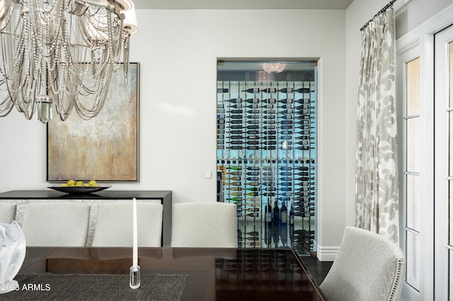 wine area featuring an inviting chandelier