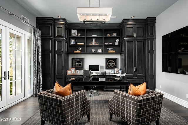 home office with dark hardwood / wood-style flooring, a wealth of natural light, and french doors