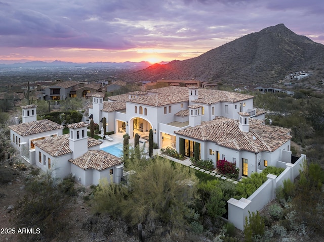 aerial view at dusk with a mountain view