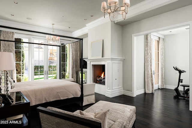 bedroom with an inviting chandelier, ornamental molding, and dark hardwood / wood-style floors