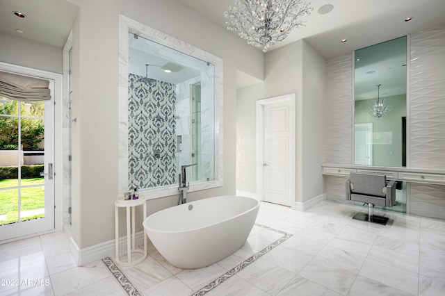 bathroom featuring an inviting chandelier and shower with separate bathtub