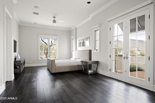 unfurnished bedroom with french doors, dark wood-type flooring, crown molding, a mountain view, and access to exterior