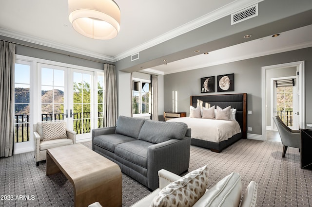 carpeted bedroom featuring crown molding, a mountain view, french doors, and access to outside