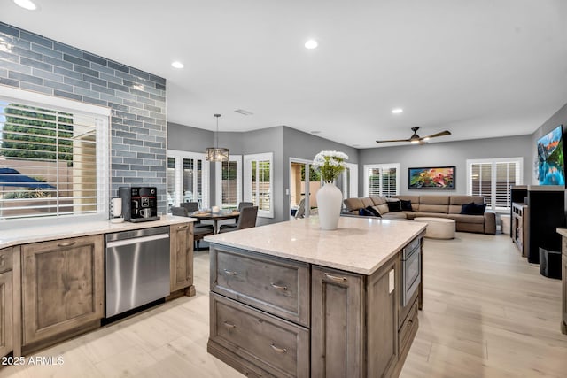 kitchen with light wood-type flooring, stainless steel appliances, ceiling fan, and recessed lighting