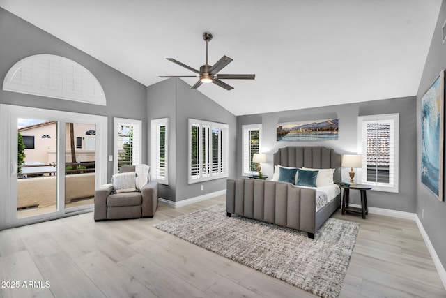 bedroom with a ceiling fan, wood finished floors, baseboards, vaulted ceiling, and access to outside