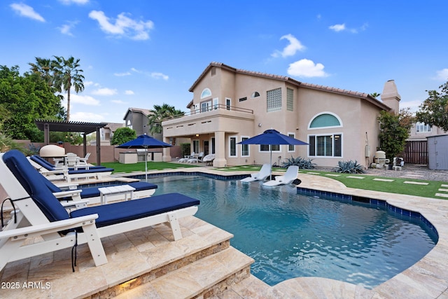 view of swimming pool with a patio area, fence, a fenced in pool, and a pergola