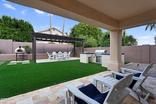 view of patio / terrace with a gazebo, area for grilling, and a fenced backyard