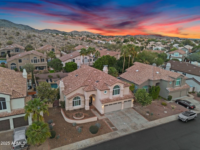 bird's eye view featuring a mountain view and a residential view