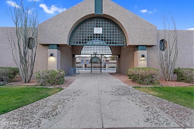 view of property's community with a gate