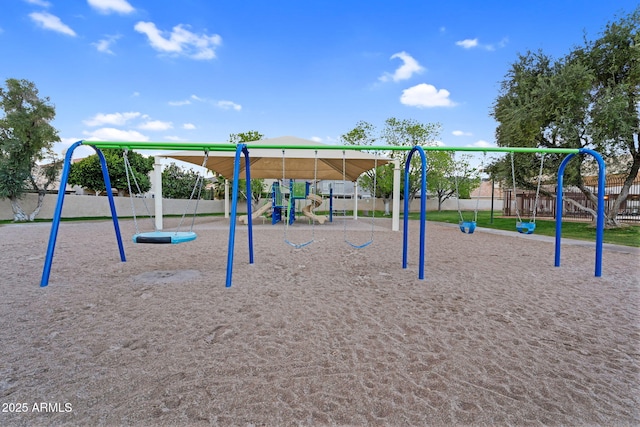 communal playground featuring fence