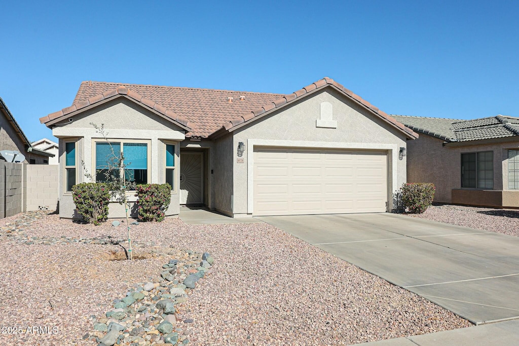 ranch-style home featuring a garage