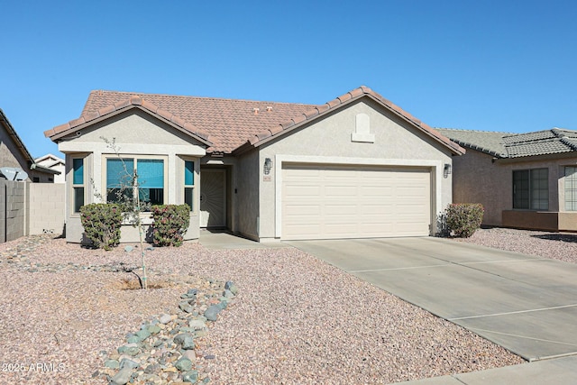 ranch-style home featuring a garage