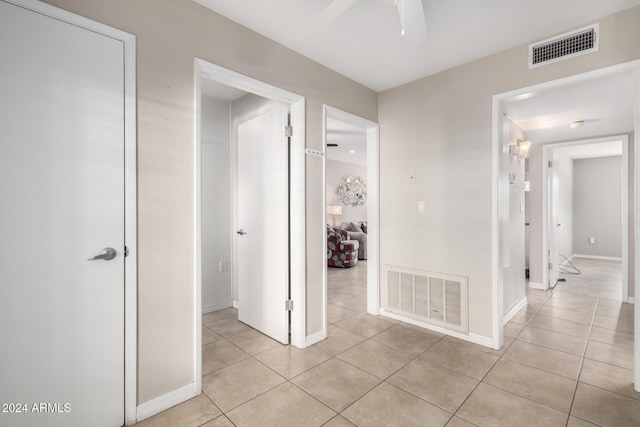 hallway with light tile patterned flooring