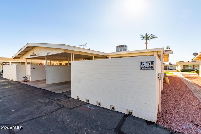 view of side of property with a carport