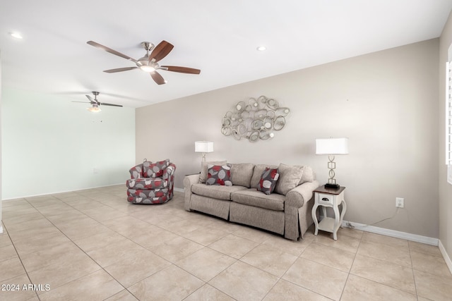 living room featuring ceiling fan and light tile patterned floors