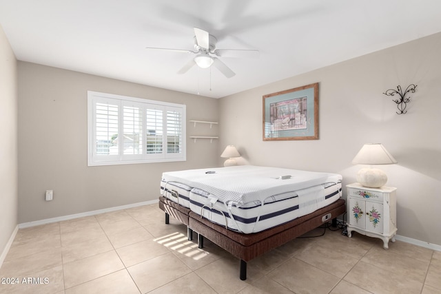 bedroom featuring light tile patterned floors and ceiling fan