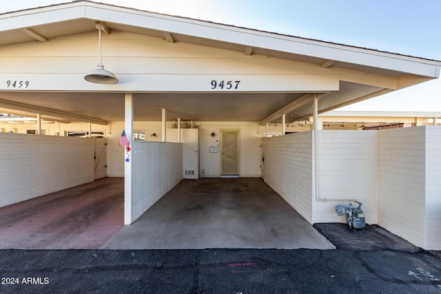 property entrance with washer / clothes dryer and a carport