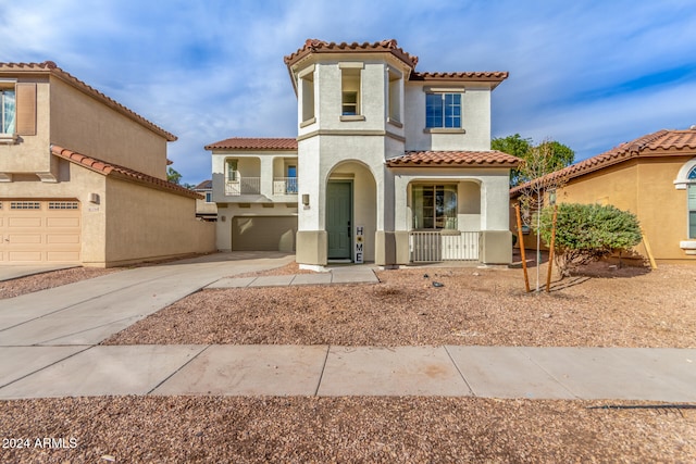 mediterranean / spanish-style house featuring a garage