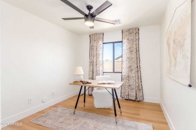 office space featuring hardwood / wood-style flooring and ceiling fan