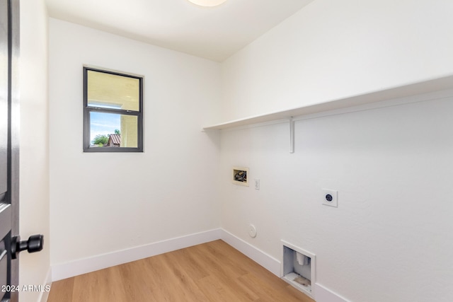 laundry room with hookup for a gas dryer, hookup for a washing machine, light hardwood / wood-style floors, and electric dryer hookup