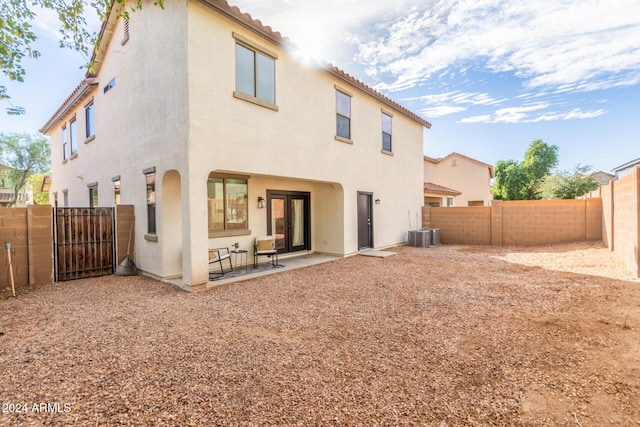 back of property with a patio