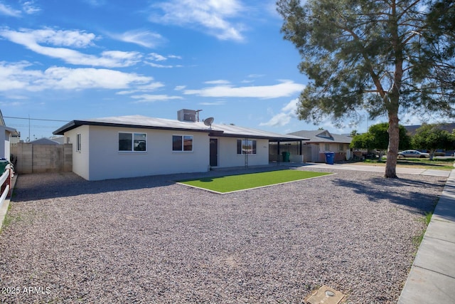 exterior space with a patio, central AC unit, and fence