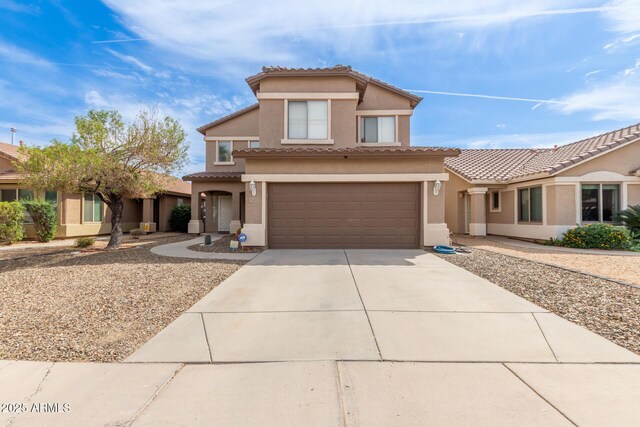 13001 W Bloomfield Rd, El Mirage, AZ 85335 - view of front of house featuring stucco siding, a garage, a tiled roof, and concrete driveway